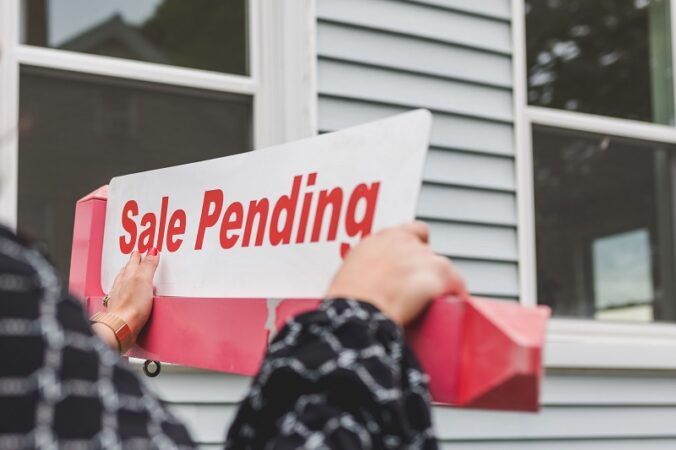 Pending home sale sign showing a property transaction in progress for hidden land costs article context.