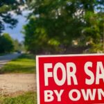 For Sale By Owner sign on vacant land, helping buyers decide if that land is worth it.