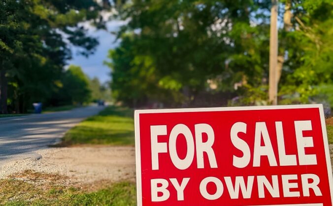 For Sale By Owner sign on vacant land, helping buyers decide if that land is worth it.